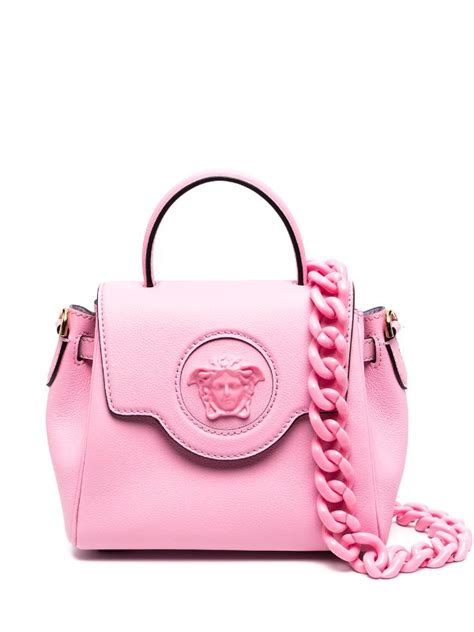 pink Versace perfume with backpack